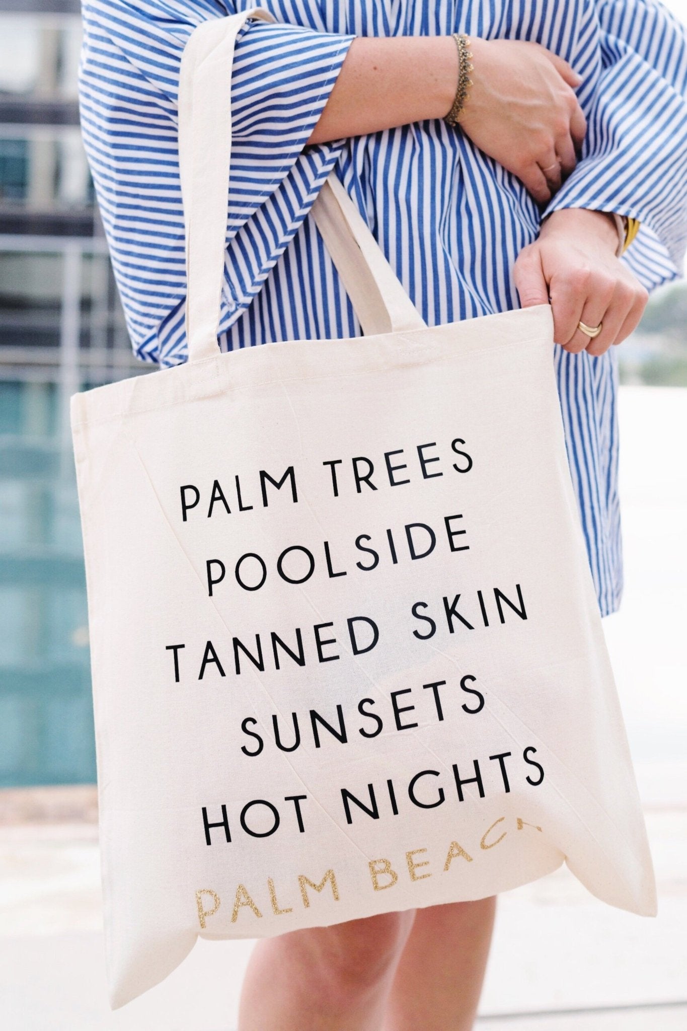A cotton tote is customized with a black and gold Palm Beach design.