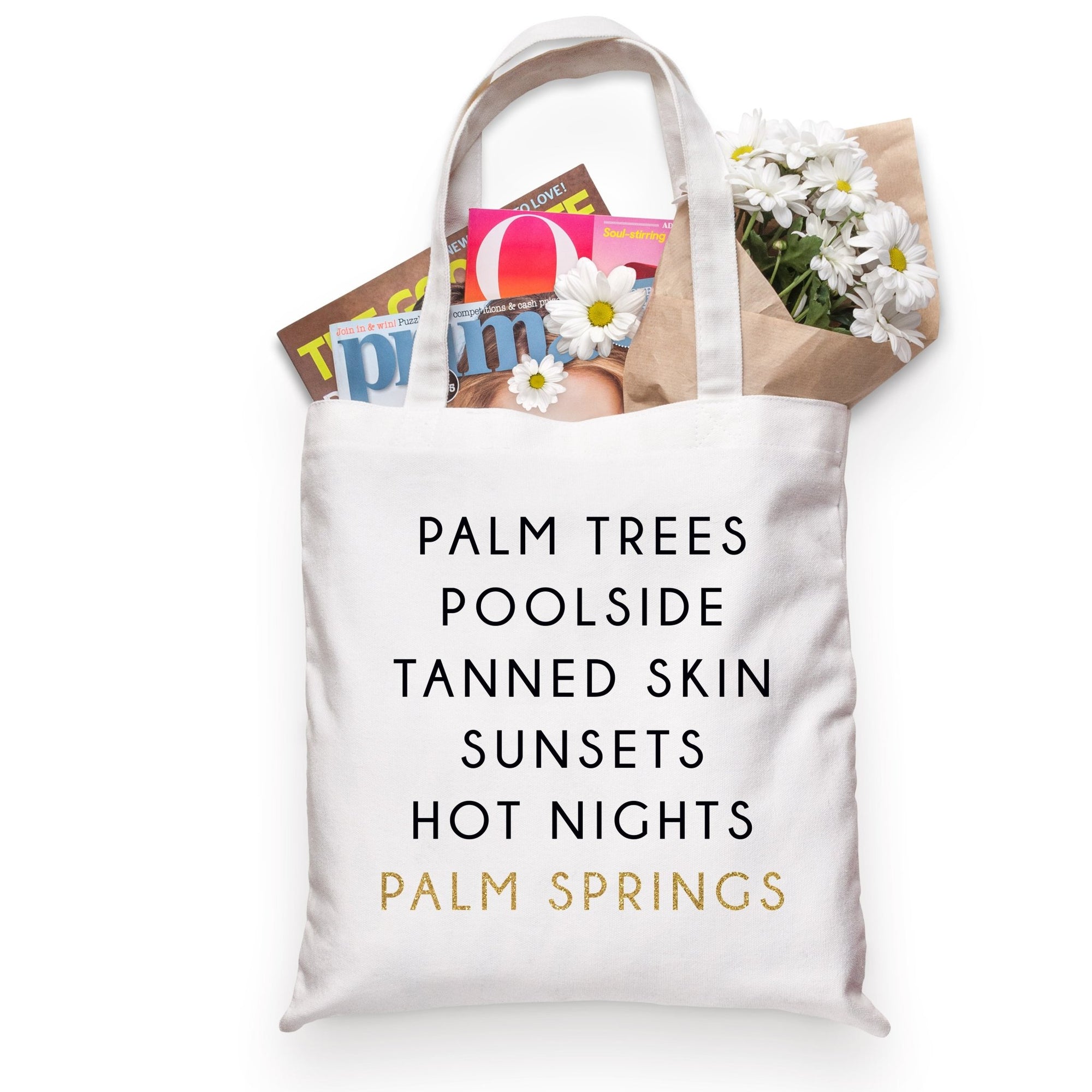 A cotton tote is customized with a black and gold Palm Springs design.
