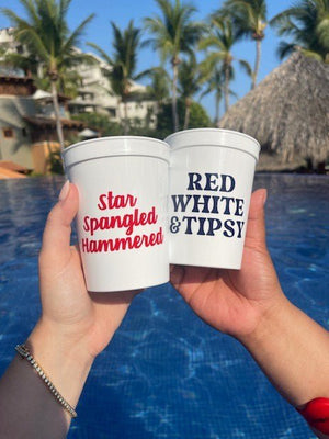Two white, stadium cups customized with patriotic phrases