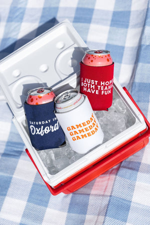 Canned drinks with can coolers sit in an ice chest