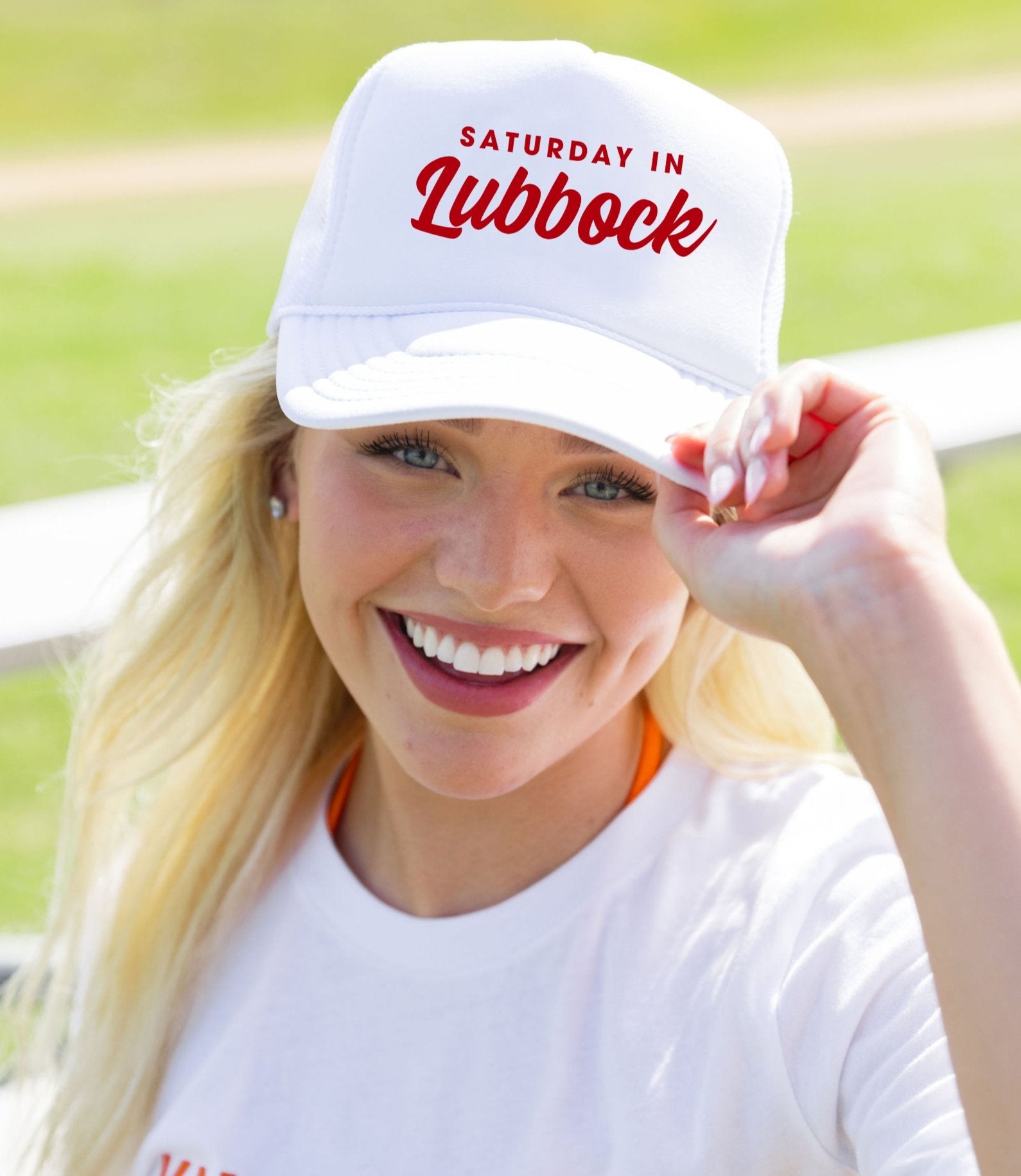 A white trucker hat from our gameday collection that reads "Saturday in Lubbock" on a white background.