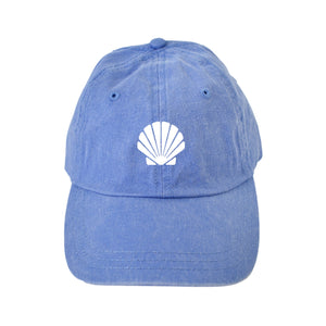 A blue baseball hat is customized with a white seashell design.