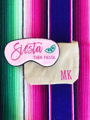 A sleep mask with a "Siesta then Fiesta" design is paired with a monogrammed jute pouch.