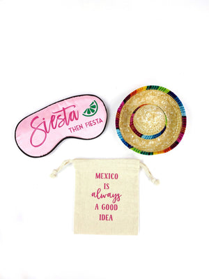 A pink sleep mask that says "Siesta then Fiesta", a sombrero, and a small pouch that says  "Mexico is always a good idea" are customized. 