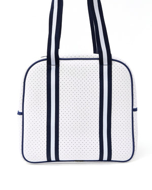 A navy and white pickleball bag is held up to show the back of the bag.