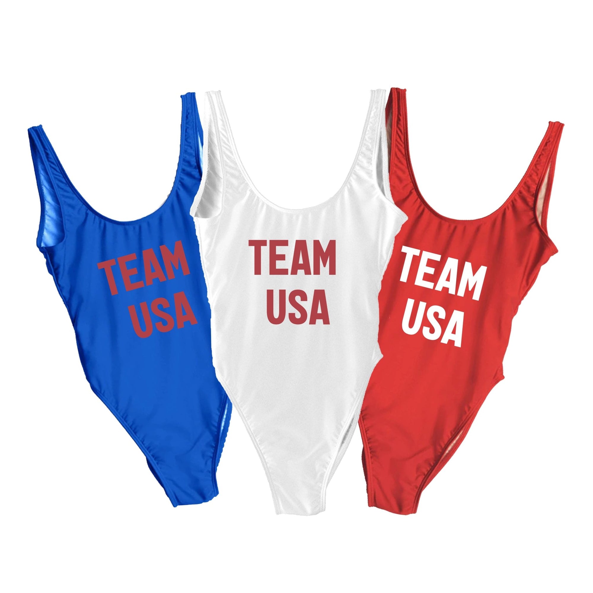 Red, white, and blue swimsuits that read "Team USA" on the front