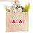 A jute tote reads "VACAY" across the front in pink and red letters