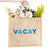 A jute tote reads "VACAY" across the front in pink and red letters