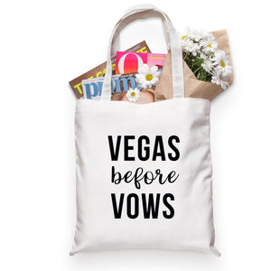 A tote bag filled with magazines and flowers is customized with a design that says "Vegas before Vows