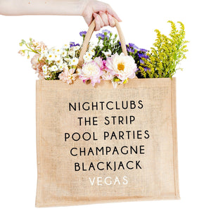 A jute carryall tote customized with sayings about Vegas