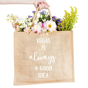 A custom jute bag reads "Vegas Is Always A Good Idea" on the front