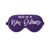 A purple sleep mask is customized with a white design that says "Wake Me In New Orleans".