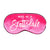 A pink sleep mask is customized with a white design that says "Wake Me In Scottsdale".