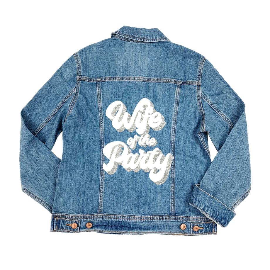 A jean jacket reads "Wife of the Party" on the back panel