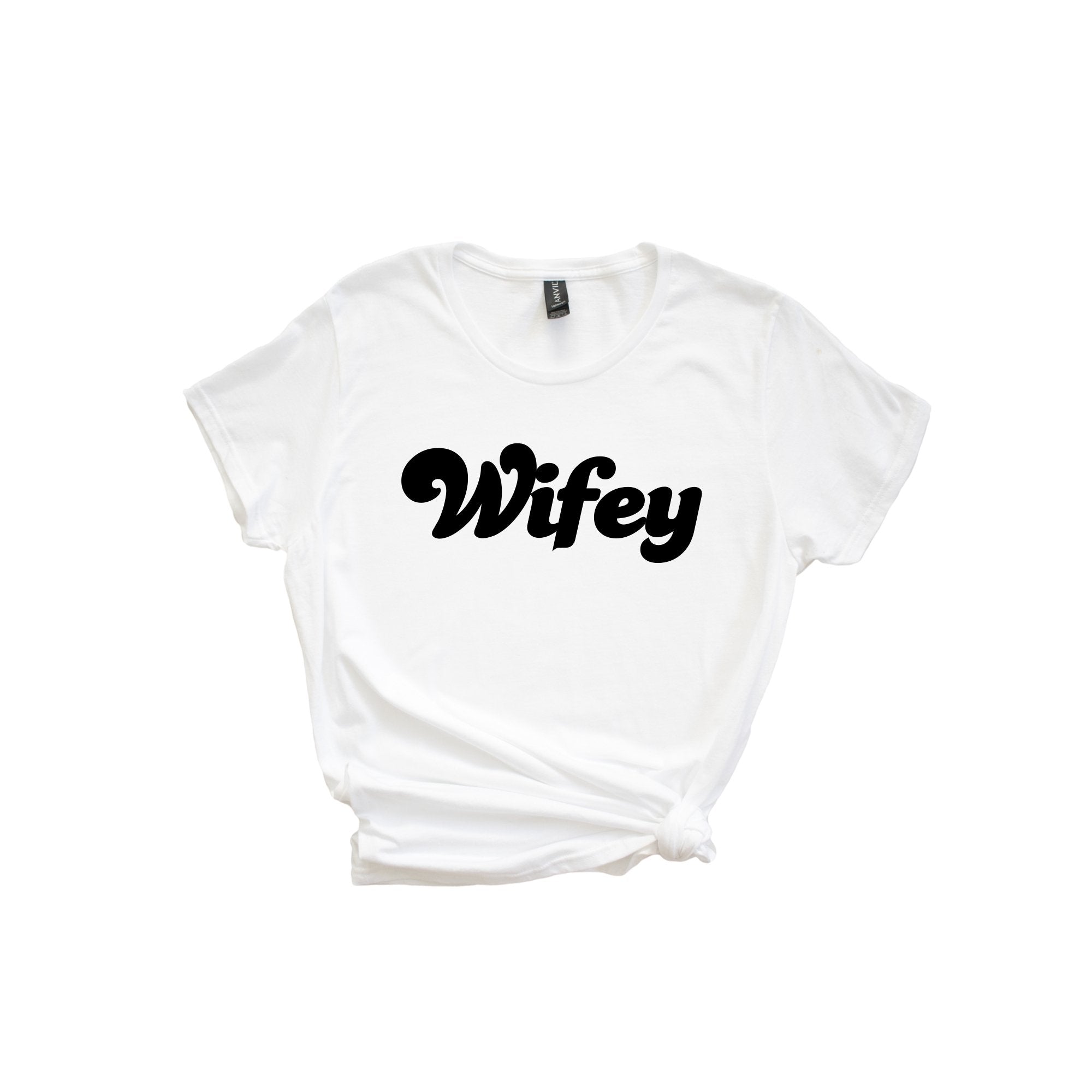 A white shirt is customized with "Wifey" in black.
